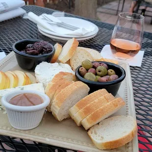 Hit up the wine bar for a glass and a cheese platter to enjoy on the patio.