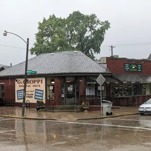 The exterior of Groppi's Groceries as viewed from the diagonal crosswalk