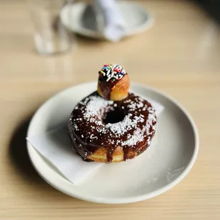  a chocolate donut with sprinkles