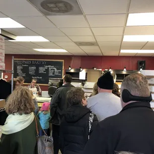 a large group of people standing in line