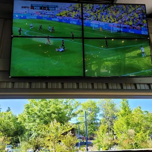 Out side seating area with big screen.