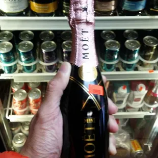 a person holding a bottle of champagne