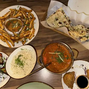 Masala Fries With Tikka Sauce Tandoori Chicken Wings 6pc Garlic NaanGarlic Veggie Samosas Chicken Tikka Masala