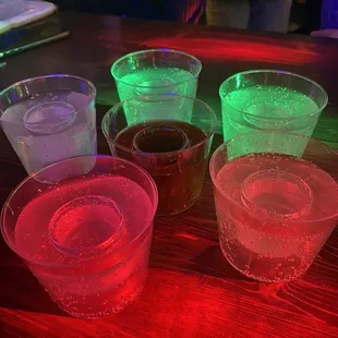 a variety of colored cups