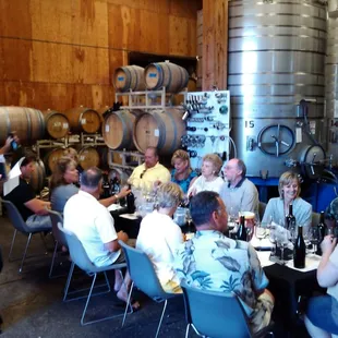 a group of people sitting around a table