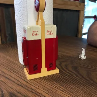 Each table has a different Coca-Cola salt and pepper shaker.