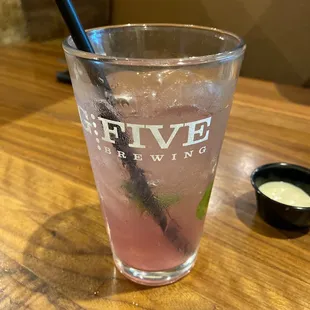 a glass of water with a straw