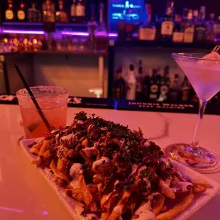 Carne asada fries the Paloma and lychee martini