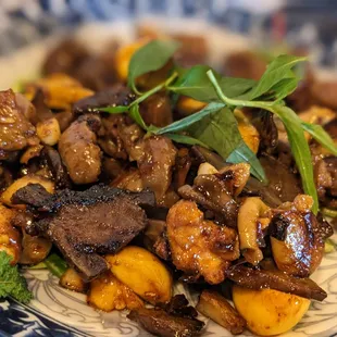 a plate of food with meat and vegetables