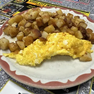 Home fries and scrambled eggs with cheese