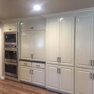 a kitchen with white cabinets