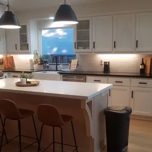 Kitchen: custom island and vent hood.