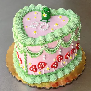 a birthday cake with a frog on top