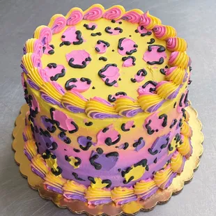 a yellow and pink birthday cake