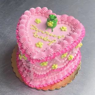 a pink heart shaped cake