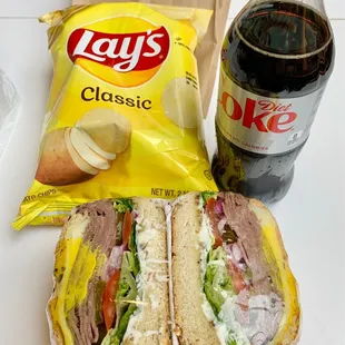 Roast beef sandwich (very good) with chips and pop.