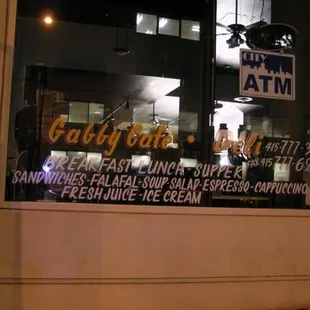 a window with a sign for a restaurant
