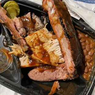 a tray of meat and beans