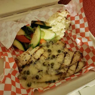 Big piece of fish with risotto and veggies, well cooked and flavorful.