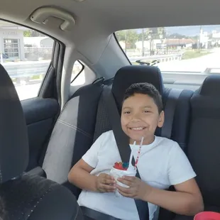 Happy little one with his cottoncandy and gummy snocone.