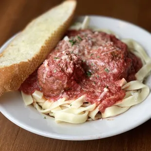 Fettuccine and Meatballs. Our meatballs are an old family recipe, which we make a roll in house.
