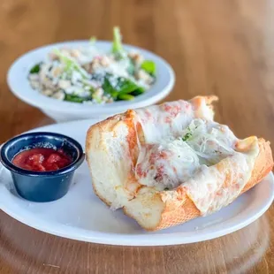 Meatball Sub with a spinach salad. One of the options on our 2 for $12 lunch specials - served Monday - Friday 11-2.