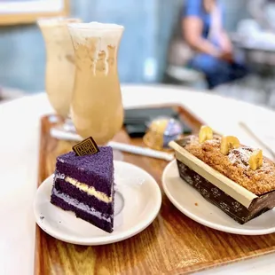 Vanilla Chai Iced - 16oz ($8), Sea salt coffee iced - 16oz ($8) - caramel, coconut milk, Ube macaron ($7.50), Banana bread ($8), Ube slice