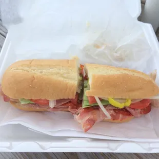 a sandwich in a styrofoam container