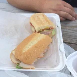 a sandwich in a styrofoam container