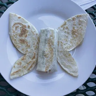 Butterfly kids plate. Wings and antennas are quesadillas and center is burrito. Sorry I ate the antennas before taking pic lol