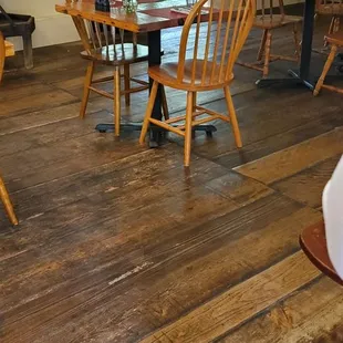 A few tables near inside hostess stand and view into back enclosure seating space