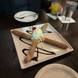 a desert with ice cream and chocolate sauce