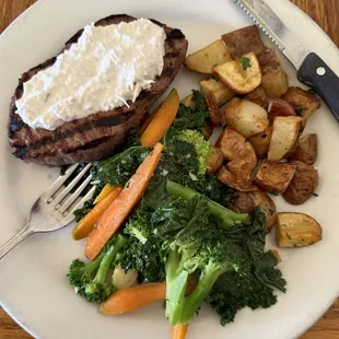 New York Steak with Horseradish. Served with steamed vegetables and roasted potatoes.