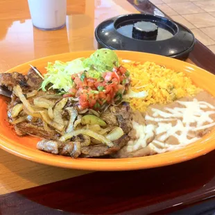 Carne asada. This cut of steak is a rib eye.