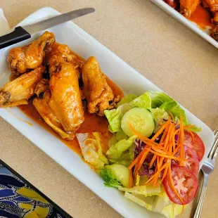 Wings with salad instead of fries. Spicy honey sauce.