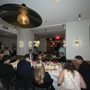 a group of people sitting at a table