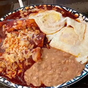 Red Enchiladas, eggs and beans