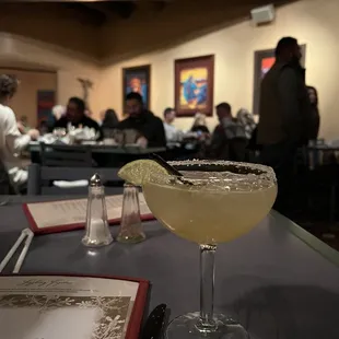a margarita with a slice of lime on the rim