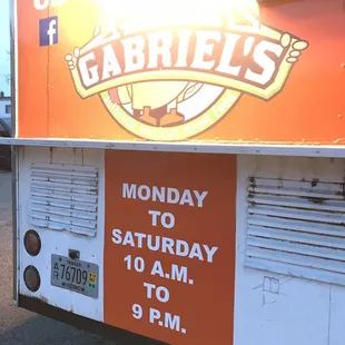 a sign on the side of a food truck