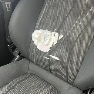 a piece of paper on the seat of a car