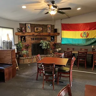 a dining area with tables and chairs