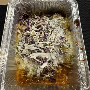To-go meal with enchiladas and red/green sauce