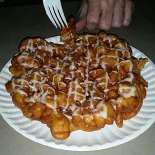 Pumpkin funnel cake with cream cheese icing