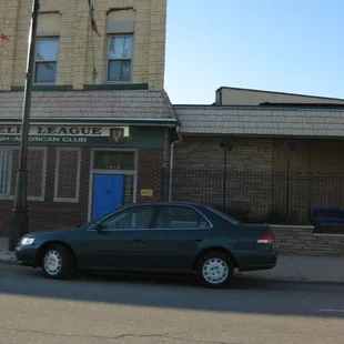 a car parked in front of a building