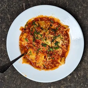 a plate of pasta with a fork