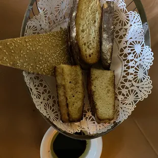 a basket of bread and a cup of coffee