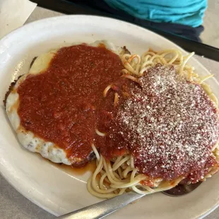 Chicken parmigiana with spaghetti.
