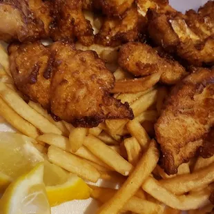 a plate of fried chicken and french fries