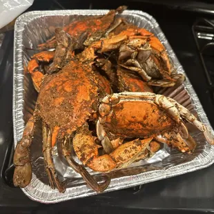 a tray of cooked crabs