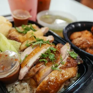 a tray of chicken and rice